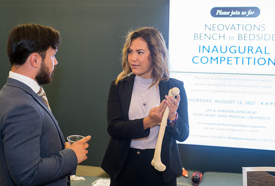 strategic-plan-2025-06 A student demonstrates an invention during a campus innovation competition.